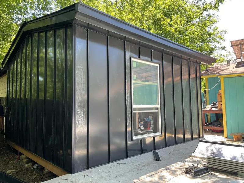 Black standing seam metal wall panels for Roof Inspection in Candlewick Lake